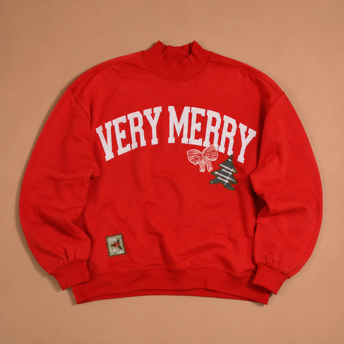 Red Vintage Very Merry Mockneck Sweatshirt with white VERY MERRY lettering, a bow, a patterned Christmas tree, and a FA LA LA patch.