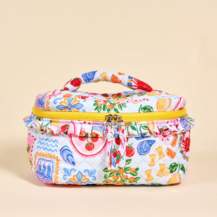 The Darling Effect's Ciao Bella Glam & Go Quilted Cosmetic Bag features a colorful Italian food print on white, a yellow zipper and handle, and is water-resistant—perfect for travel or daily use.