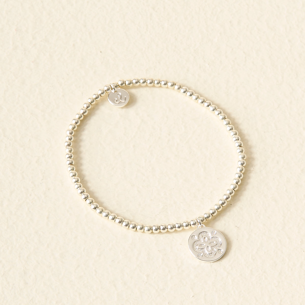 Trait Beaded Charm Bracelets