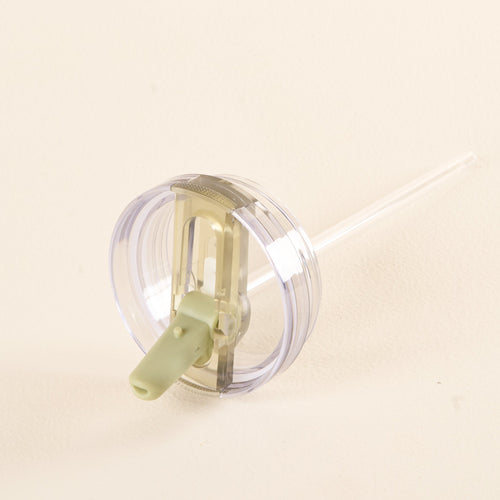 The-darling-effect's Green 40 oz Lifestyle Flip Straw Lid is a clear plastic cup lid with a light green flip straw and straight transparent straw, designed for hydration with leak-resistant construction, shown against a plain light background.