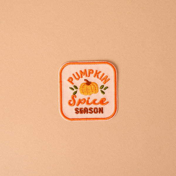 Bring a cozy autumn vibe to your favorite jacket or bag with The Darling Effect’s On Patch-Pumpkin Spice Season Mix & Match Iron! This embroidered patch features a charming pumpkin illustration along with the words “Pumpkin Spice Season” in vibrant orange and yellow on a light peach background—perfect for customizing your look and adding seasonal flair with colorful, iron-on designs.