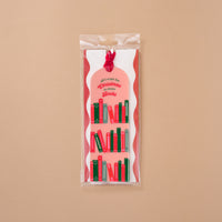 The All I Want for Christmas is More Books Acrylic Bookmark is a clear acrylic bookmark with a velvet ribbon and printed illustrations of red and green books, featuring the text all i want for Christmas is more Books.
