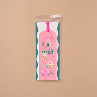 Pink Pine Village Acrylic Bookmark featuring a vertical pattern of four whimsical houses, finished with a velvet ribbon loop.