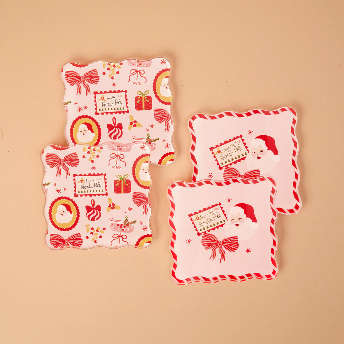 Mistletoe Magic Table Talk Acrylic Coaster Set featuring three square coasters with scalloped edges, festive Christmas illustrations of Santa Claus, gift boxes, and a tag that reads from the North Pole for artistic home décor.