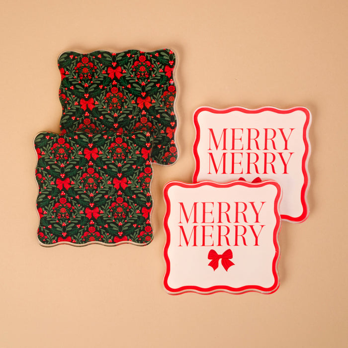 A Merry Moment Table Talk Acrylic Coaster Set featuring two square coasters with a holly and bow pattern and two white coasters with red MERRY MERRY text and bow icons, all designed with scalloped edges.