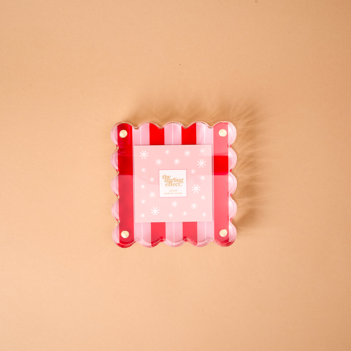 Peppermint Stripes Little Moments Acrylic Picture Frame featuring a square shape with a scalloped edge, red and white stripes, and a pink snowflake-patterned insert.