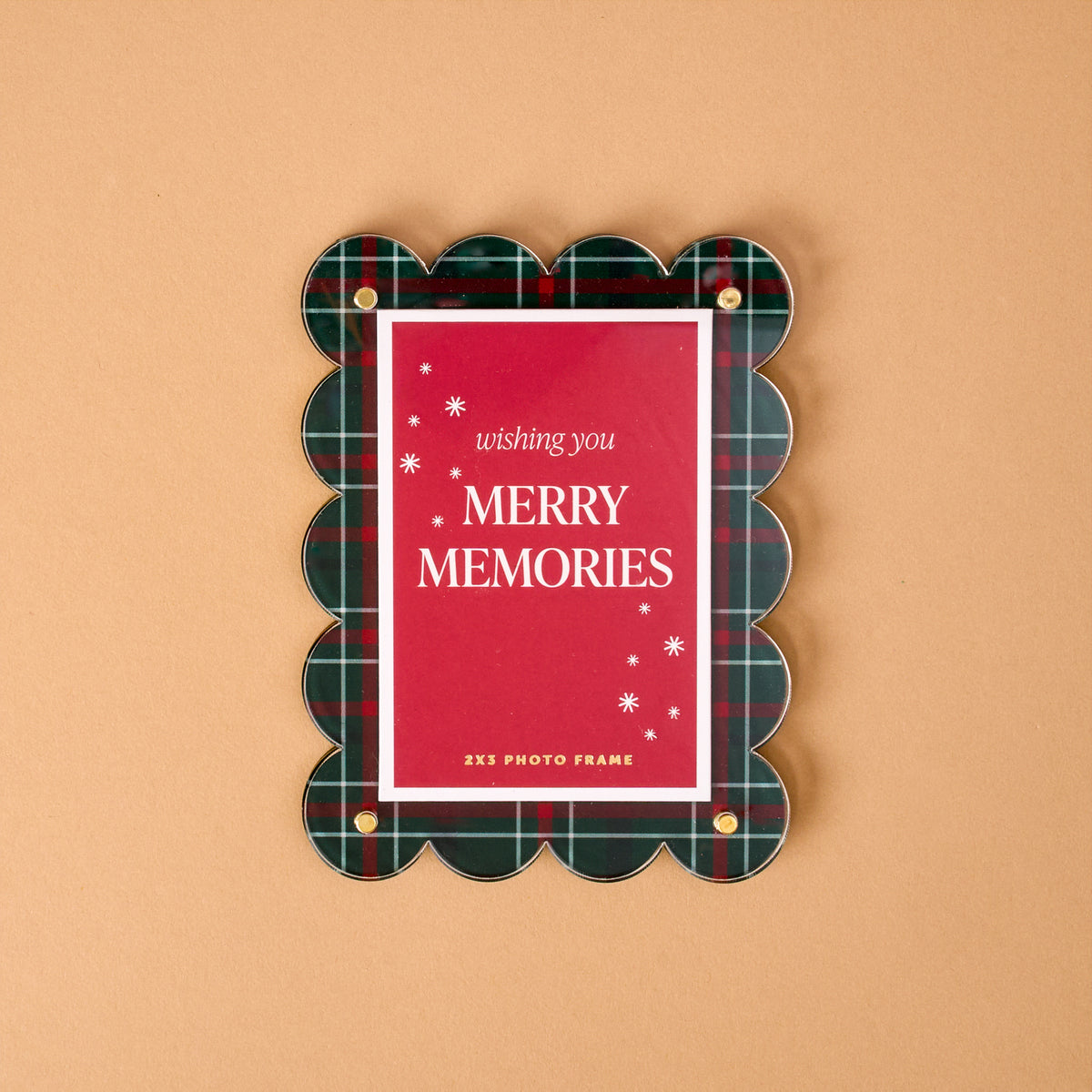 Evergreen Plaid Mini Acrylic Picture Frame Magnet holding a red card that says wishing you MERRY MEMORIES with white snowflake icons.