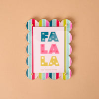 Fa La La Mini Acrylic Picture Frame Magnet with a scalloped edge and colorful vertical stripes, holding a card that reads FA LA LA in block letters.