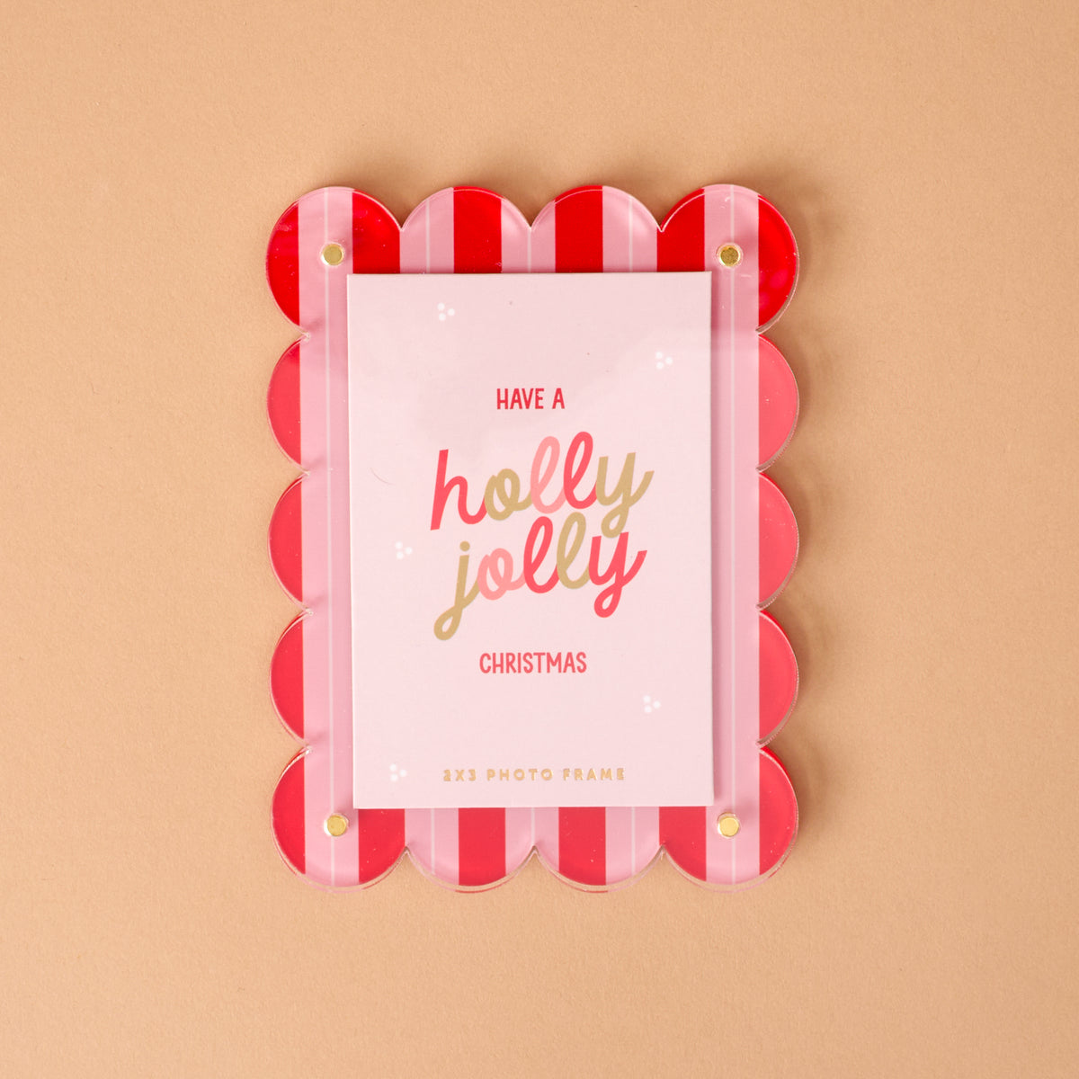 Peppermint Stripes Mini Acrylic Picture Frame Magnet with red and pink scalloped edges, holding a card that reads Have a holly jolly Christmas.
