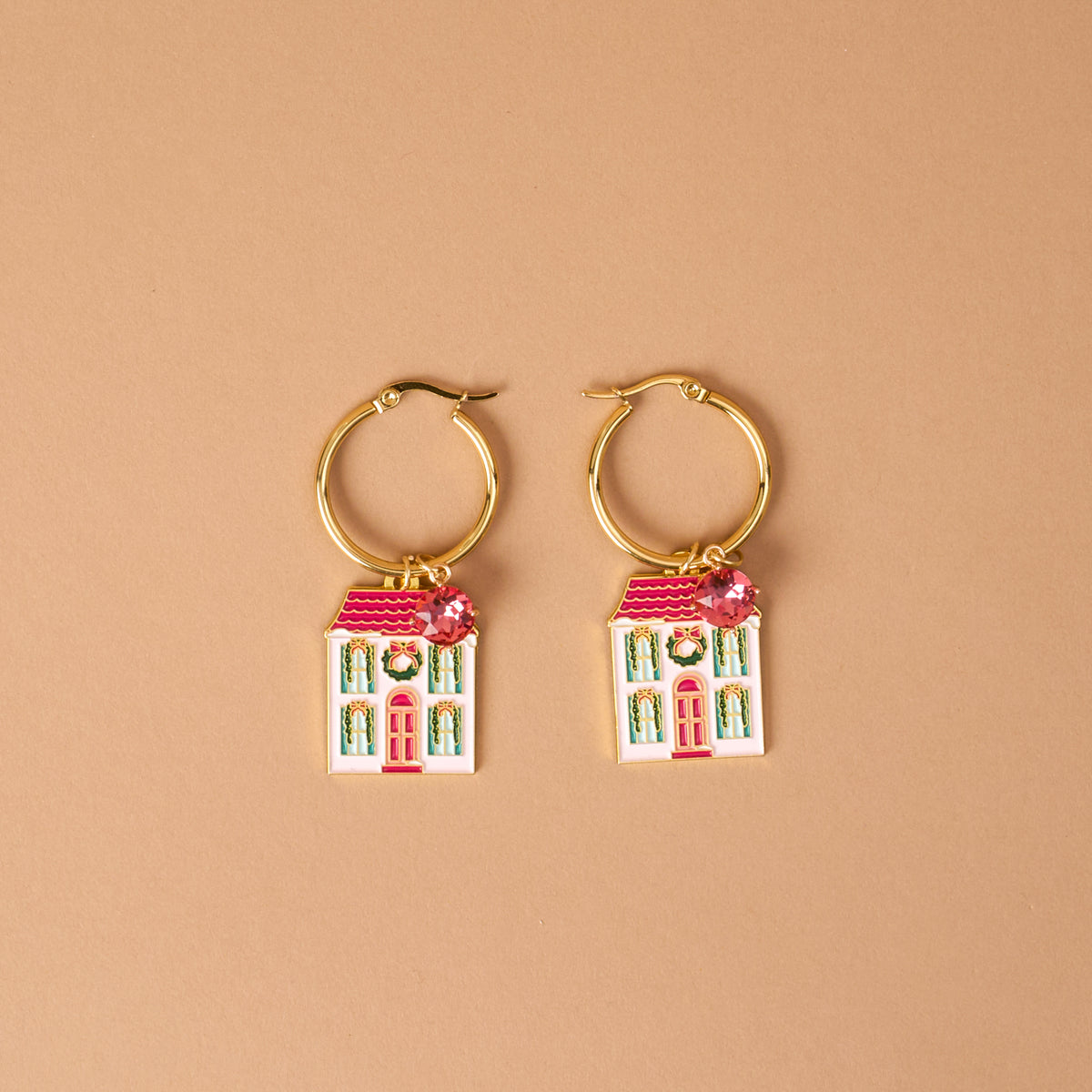 BowBelle Manor Signature Hoop Earrings featuring lightweight charms shaped like white houses with pink roofs, decorated with wreaths and small pink crystals.
