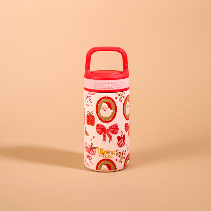 Mistletoe Magic 6 oz Lil’ Bitty Bottle, a petite insulated water bottle with a red carrying handle and a festive pattern of Santa Claus, gift boxes, and bows.