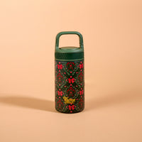 A Merry Moment 6 oz Lil’ Bitty Bottle, a small, 6oz insulated water bottle featuring a festive pattern of red bows, holly, and berries, finished with a green screw-top lid and handle.