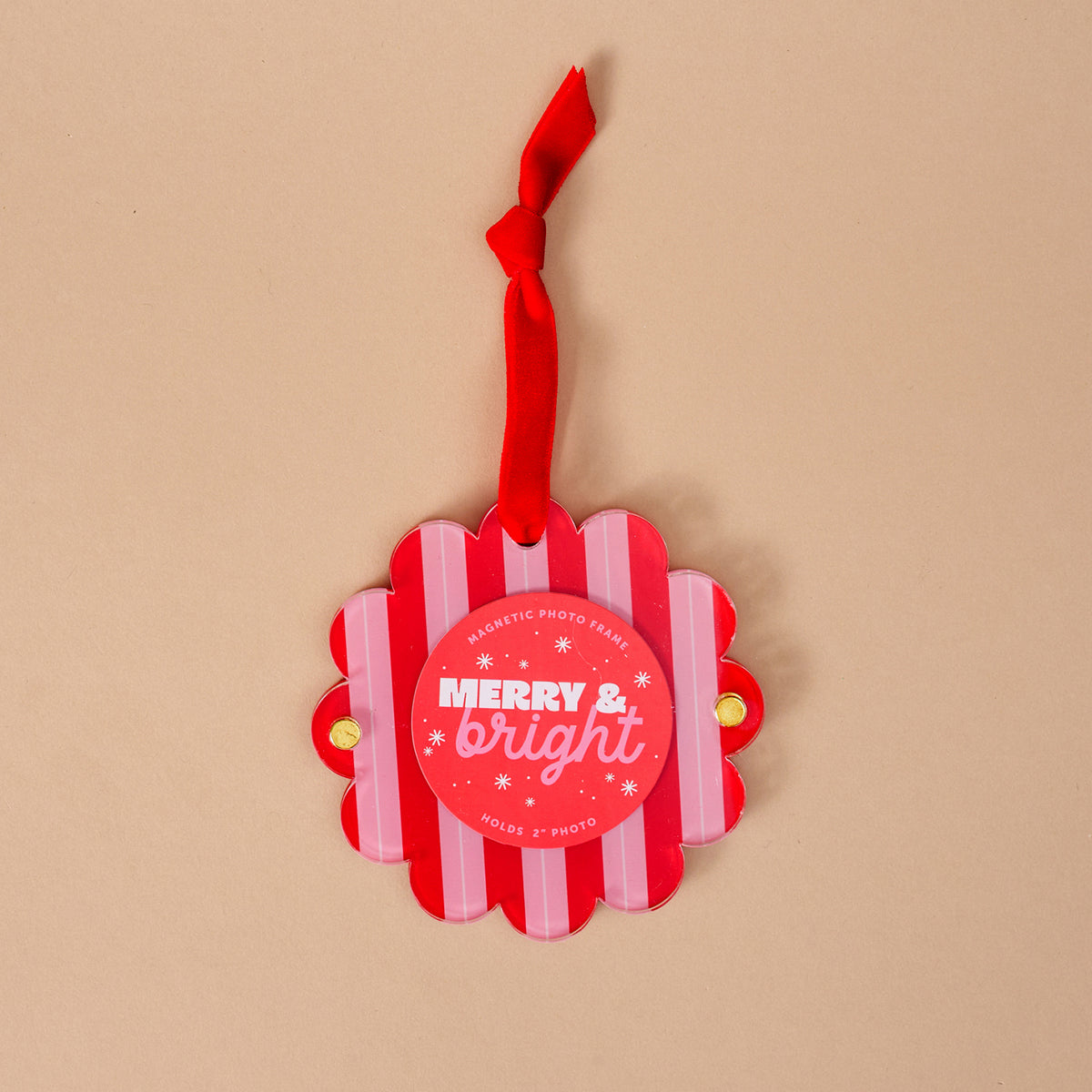 The Darling Effect's Peppermint Stripes Scalloped Round Picture Frame Ornament features red and white stripes, a red ribbon, "MERRY & bright" in white text, and snowflake accents—perfect for your holiday display!.