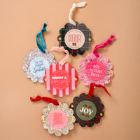 Six Silver Glitter Scalloped Round Picture Frame Ornaments by The Darling Effect, featuring velvet ribbons and seasonal phrases like Merry & Bright and Oh What Fun.