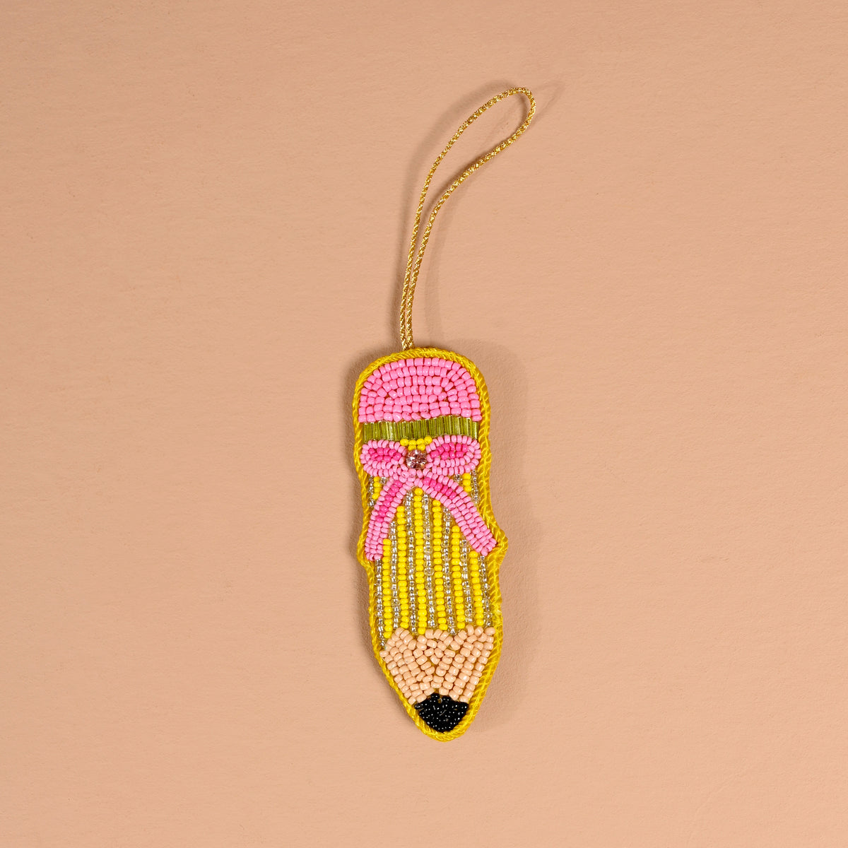 The Darling Effect Pencil Handcrafted Beaded Ornament shaped like a pencil with a pink eraser, yellow body, and black tip, featuring a decorative pink bow and a gold hanging loop.