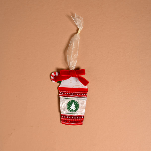 Peppermint Latte Acrylic Ornament shaped like a coffee cup with a red bow, a peppermint candy charm, and a circular logo featuring a Christmas tree, perfect for holiday styling.