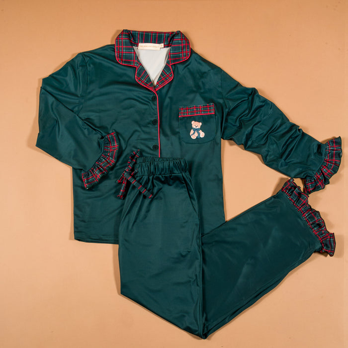 Evergreen Plaid Sweet Dreams Pajama Pants Set in dark green featuring a plaid collar, cuffs, and pocket trim, with a small teddy bear embroidered on the chest pocket.