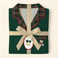 Folded dark green Evergreen Plaid Sweet Dreams Pajama Shorts Set with a red and green plaid collar and pocket, tied with a cream-colored ribbon and a branded gift tag featuring a teddy bear illustration.