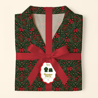 Folded A Merry Moment Sweet Dreams Pajama Shorts Set featuring a dark green Christmas holly and red bow print, wrapped in a red ribbon with a product label.