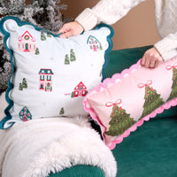 Hands hold the Home Sweet Home Scalloped Square Throw Pillow and a matching rectangular pillow with embroidered Christmas trees, both featuring scalloped edges.