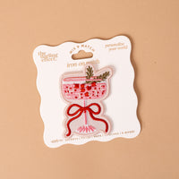 Cranberry Cosmo Mix & Match Iron-On Patch featuring a colorful embroidered pink cocktail in a stemmed glass, garnished with a sprig of rosemary and tied with a red ribbon.