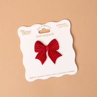 Red Bow Mix & Match Iron-On Patch featuring a red embroidered bow-shaped patch on white packaging, designed for customizing jackets.