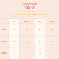 Sizing chart for the Alpha Chi Omega Teddy Bear Mockneck Sweatshirt S/M by The Darling Effect, displaying bust, length, and sleeve measurements (in inches) plus a fit guide—ideal for your next teddy bear or sorority sweatshirt purchase.