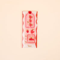 The Darling Effect’s Farm Fresh Strawberries Acrylic Bookmark makes a perfect gift for book lovers—pair with decorative stickers featuring strawberries, pink flowers, scalloped edges, and the phrases “Farm Fresh” and “Strawberries.”.
