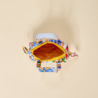 The Darling Effect's Ciao Bella Itty Bitty Duffle Bag Charm is a small, colorful fabric handbag with floral patterns, gold zipper, yellow lining, two handles, side gold keyring, and a stylish quilted bag charm accessory.