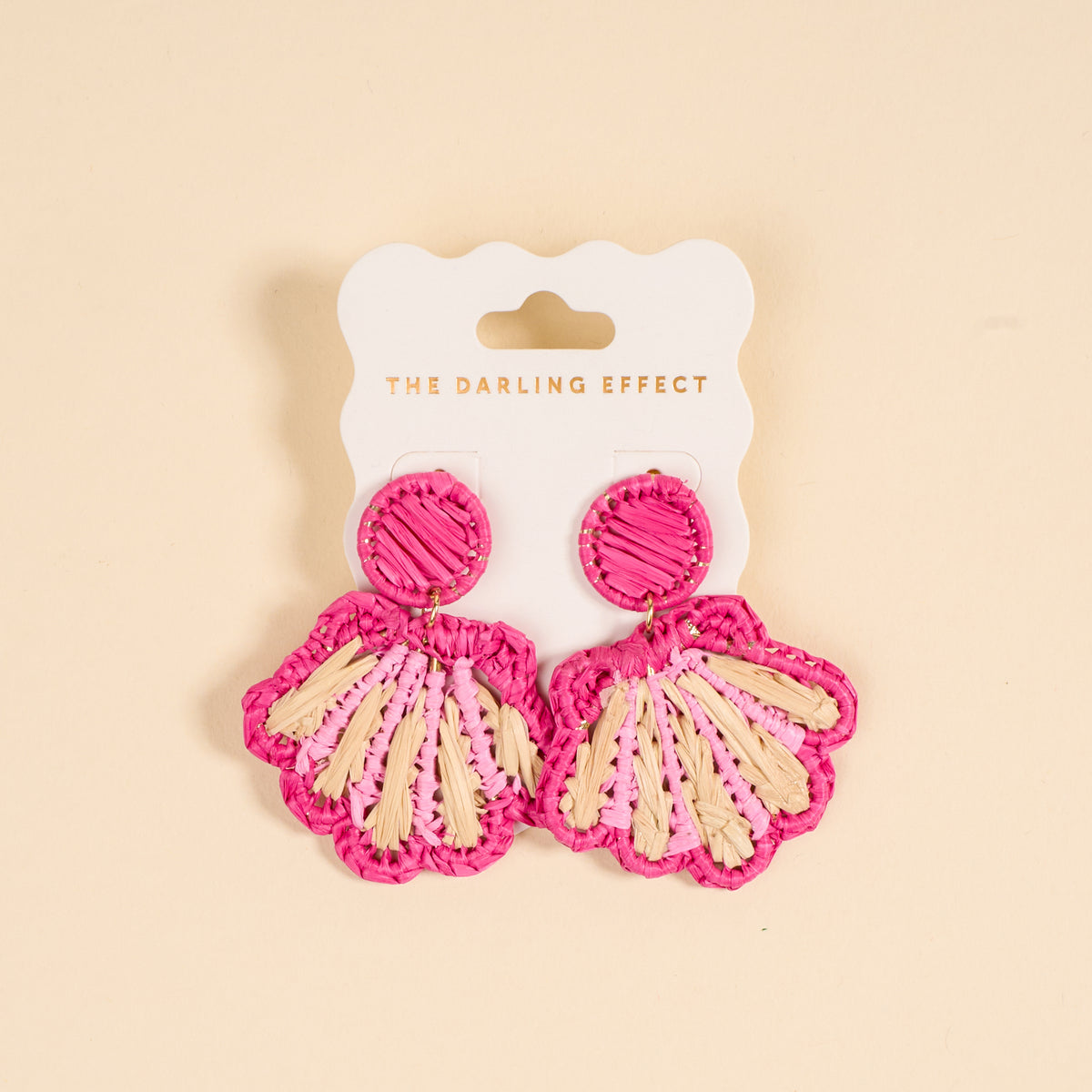 The Darling Effect Hot Pink Cabana Breeze Earrings—pink and cream boho seashell-shaped earrings on a branded card, perfect lightweight accessories for everyday wear.