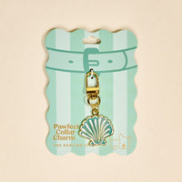 The Darling Effect's Seashell Pawfect Collar Charm features a gold and mint green seashell design on a striped mint card with cat and dog illustrations—an adorable accessory to elevate your pet’s style.