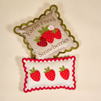 Add a cozy touch with The Darling Effect’s Farm Fresh Strawberries Scalloped Square Throw Pillow, featuring scalloped edges, embroidered strawberries, and red trim. Pillow cover and insert included.