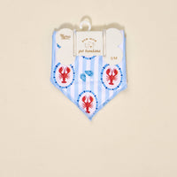 The Darling Effect Bow-Wow Pet Bandana-Harbor House in blue and white stripes with red lobster and blue shell accents is a charming S/M accessory, perfect for adding pet fashion to your pup. Comes in Bow-Wow packaging.