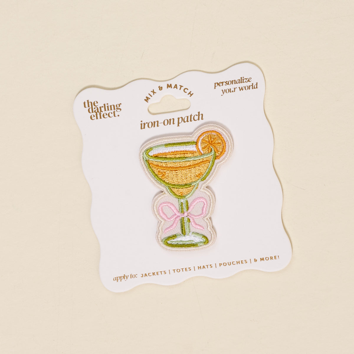 The Darling Effect's Bow-Tied Margarita Mix & Match Iron-On Patch is a colorful margarita glass with lime, on a wavy-edged card. Perfect for customizing jackets or bags—includes branding details and application tips.