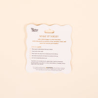 A white, scalloped-edge card titled "MAKE IT YOURS" in gold text gives instructions and warnings for applying The Darling Effect's Lake Day Mix & Match Iron-On Patch to jackets. Card has a pale beige background with clear ironing steps for customization.
