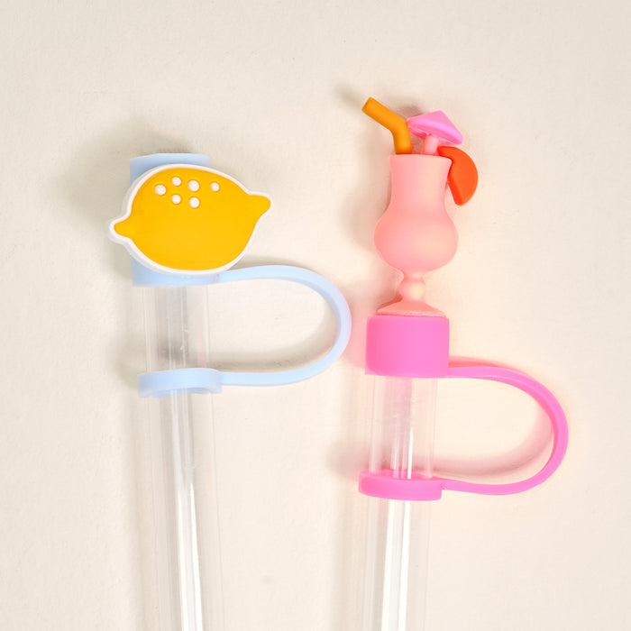 The Darling Effect’s Limoncello Love Straw Topper Set includes two reusable, leak-resistant straws with handles—one with a yellow lemon slice and blue handle, the other with a pink cocktail-shaped topper and pink handle.