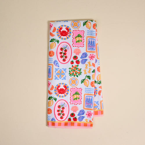 The Ciao Bella Waffle Tea Towel by The Darling Effect features playful crab, cherry, lemon, cake, flower, and abstract prints on white—an absorbent way to brighten any kitchen.