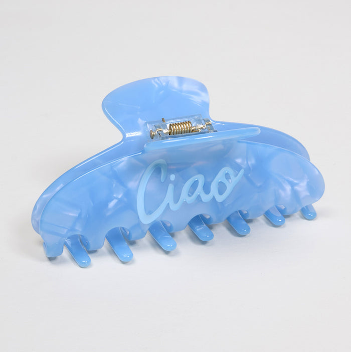 The Darling Effect's Ciao Word Up Claw Clip features a light blue marble print and "Ciao" on the side—a bold hair accessory that elevates any look.