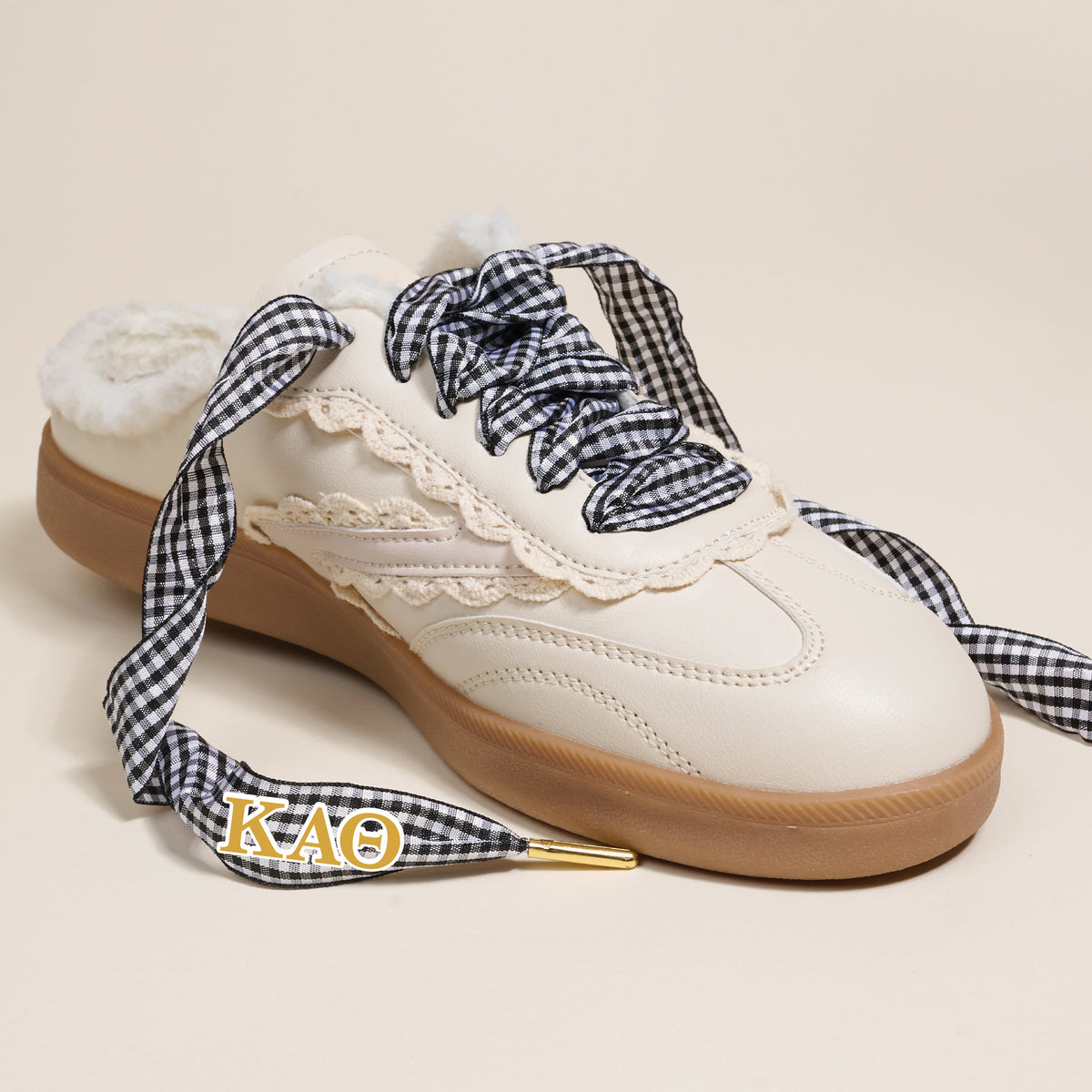 The Darling Effect’s Kappa Alpha Theta Step It Up Shoelaces feature black-and-white gingham laces with gold ΚΑΘ charm tips, designed to add Greek flair to your favorite sneakers.