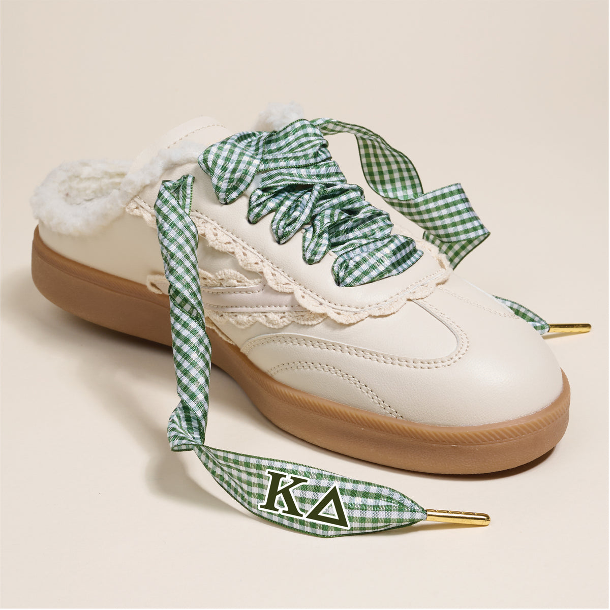 Add a pop of sorority style with Kappa Delta Step It Up Shoelaces by The Darling Effect—green and white gingham laces with lace trim, fuzzy lining, and the chapter letters K and Δ on the tips.