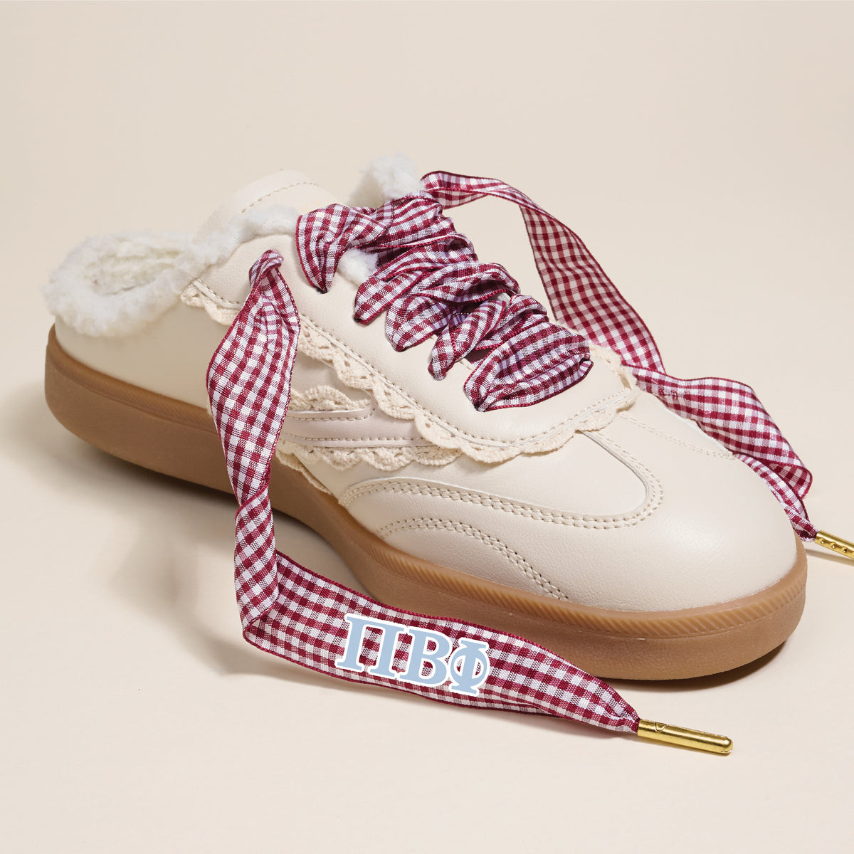 The Darling Effect Pi Beta Phi Step It Up Shoelaces feature thick red-and-white gingham laces with blue Greek letters ΠΒΦ on the lace tips, making them a standout sorority accessory.