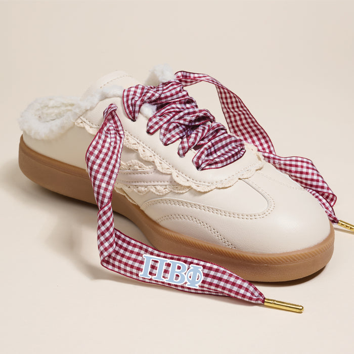 The Darling Effect Pi Beta Phi Step It Up Shoelaces feature thick red-and-white gingham laces with blue Greek letters ΠΒΦ on the lace tips, making them a standout sorority accessory.