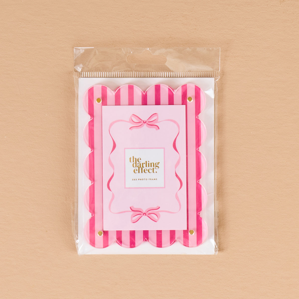 Sweetheart Stripes Mini Acrylic Picture Frame Magnet, a scalloped acrylic frame with pink and white vertical stripes and a central card featuring pink ribbons.