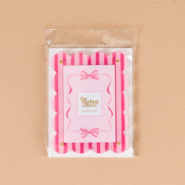 Sweetheart Stripes Mini Acrylic Picture Frame Magnet, a scalloped acrylic frame with pink and white vertical stripes and a central card featuring pink ribbons.