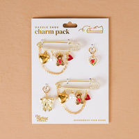 The Darling Effect’s Beary in Love Dazzle Shoe Charm Pack features gold pins with pearl, heart, bear, and strawberry charms—including a gold bow and small strawberry—perfect for adding Valentine’s flair to your footwear.