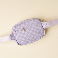 The Darling Effect's Periwinkle Urban Check Belt Bag features vegan leather, a zippered front pocket, and a matching adjustable strap, shown on a light beige background—ideal for enhancing women's fashion essentials.