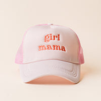 The Darling Effect's Girl Mama Trckr Hat features “girl mama” in pink embroidery on pink and white panels, shown against a light beige background—ideal for trendy hat lovers.