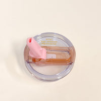 The Darling Effect 20 oz Light Pink Lifestyle Flip Straw Replacement Lid features a pink flip straw, light brown accent, and "NEW! leak-resistant seal for your flip straw tumbler" text on a plain white background.