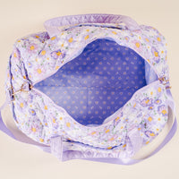 The-darling-effect Bouquet Beauty Purple On-the-Go Quilted Weekender Bag, shown from above with its zipper open to reveal a matching light purple floral interior lining.