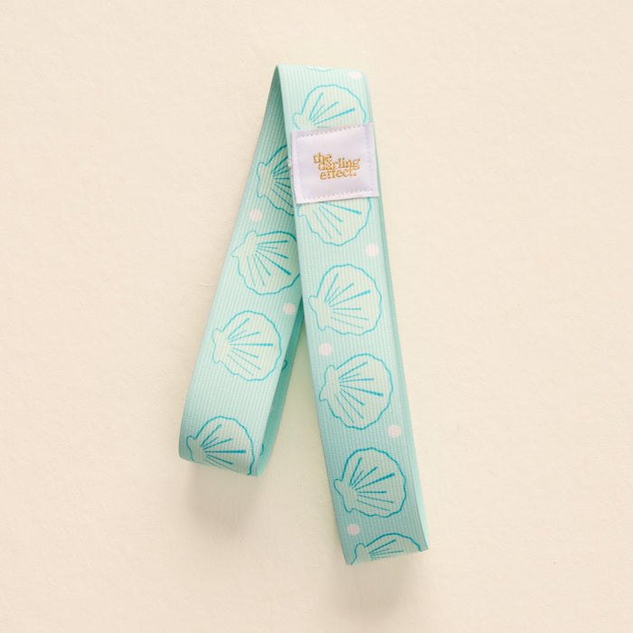 Put Towel Band-Seashells Aqua Stay